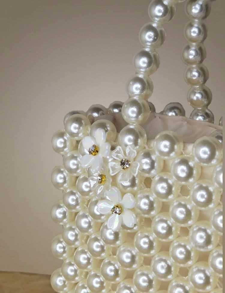 an-elegant-and-luxurious-handbag-fully-crafted-from-shiny-white-pearl