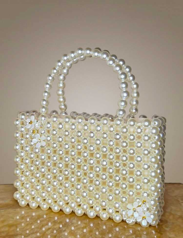 an-elegant-and-luxurious-handbag-fully-crafted-from-shiny-white-pearl