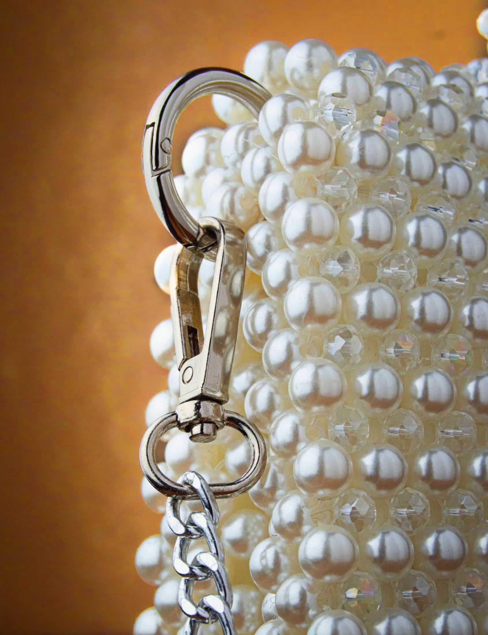 an-elegant-and-luxurious-handbag-fully-crafted-from-shiny-white-pearl