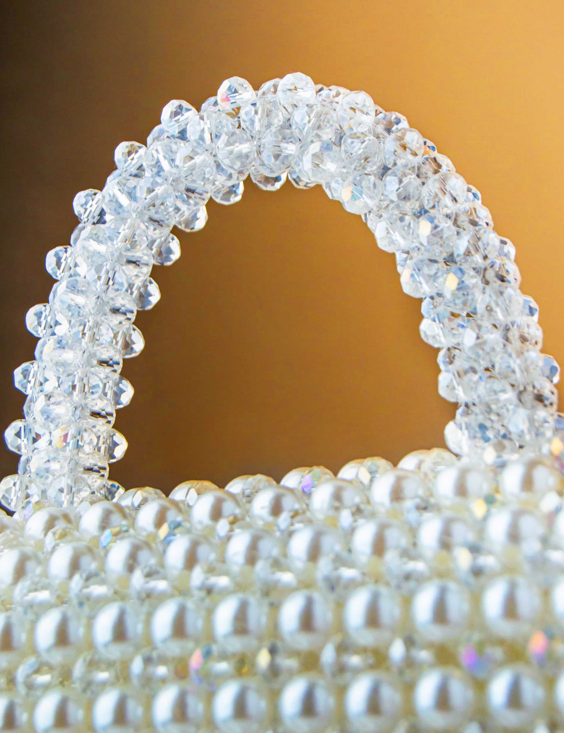 an-elegant-and-luxurious-handbag-fully-crafted-from-shiny-white-pearl