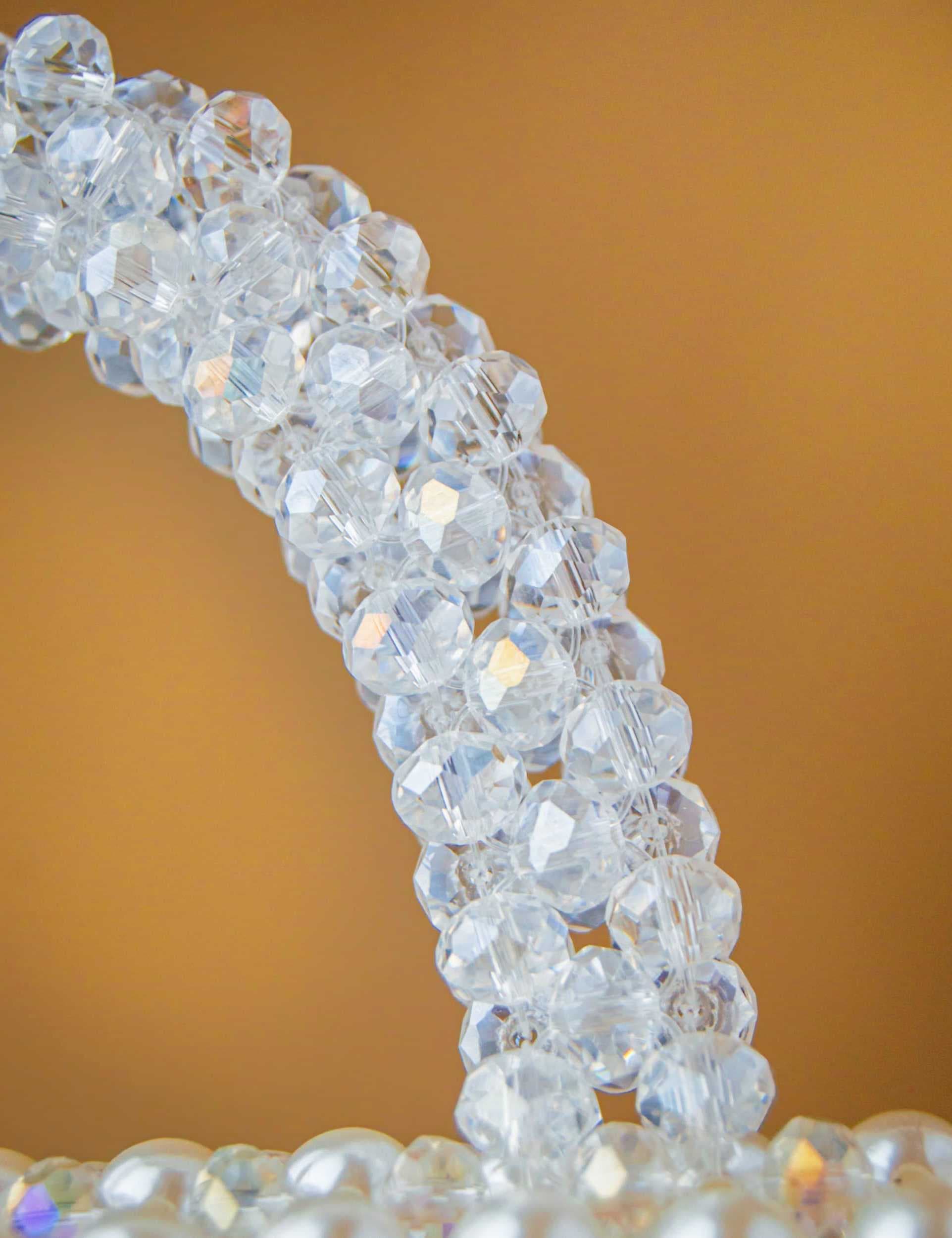an-elegant-and-luxurious-handbag-fully-crafted-from-shiny-white-pearl